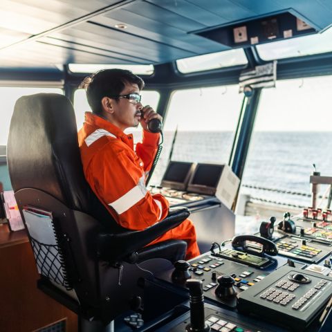 Officer on bridge of ship